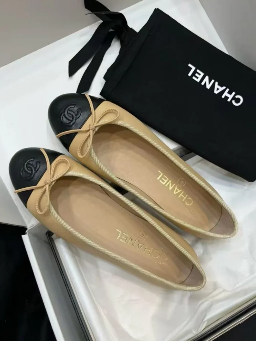CHANEL Two‑Tone Bow‑Trim Leather Round‑Toe Ballet Flats